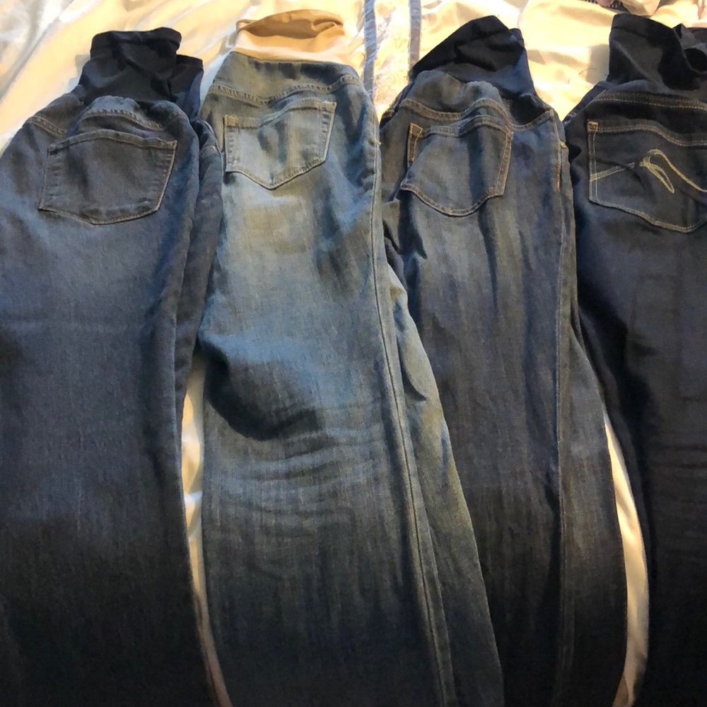 4 pairs of maternity jeans.